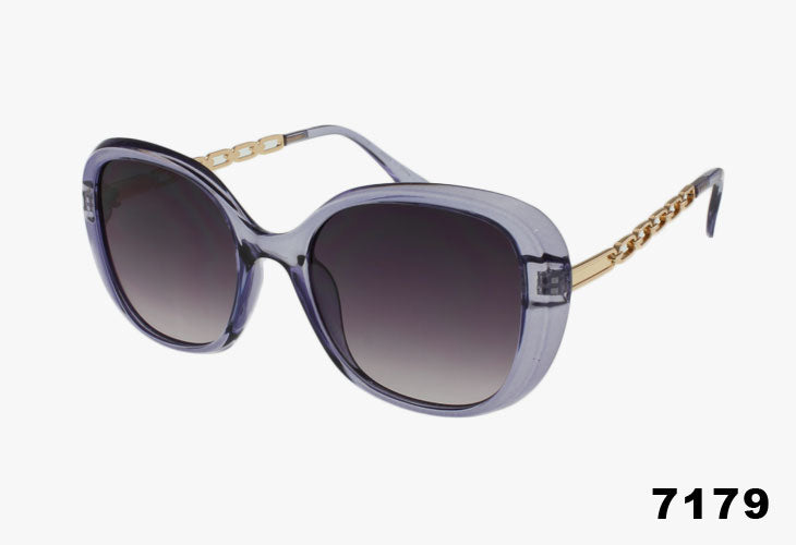 Sunglasses with gradient lenses and gold frame on a white background