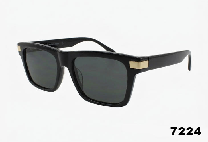 Black sunglasses with gold accents on a white background