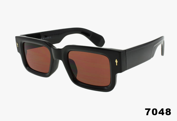 Black sunglasses with brown lenses on a white background