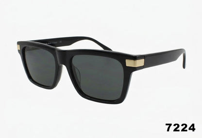 Black sunglasses with gold accents on a white background
