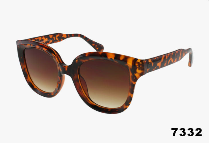 Tortoiseshell sunglasses with brown gradient lenses on a white background
